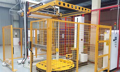Top Sheet Wrapping Machine for Complete Pallet Load Protection and Sealed Packaging